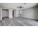 Spacious bedroom with gray vinyl flooring and ceiling fan at 5236 Woodlawn Ln, Las Vegas, NV 89130