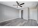 Bright bedroom with ceiling fan, gray flooring and closet at 5236 Woodlawn Ln, Las Vegas, NV 89130