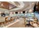 Elegant clubhouse bar with comfortable seating and TVs at 5236 Woodlawn Ln, Las Vegas, NV 89130