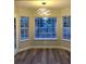 Dining area with bay windows and a modern chandelier at 5236 Woodlawn Ln, Las Vegas, NV 89130