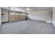 Two-car garage with epoxy coated flooring and ample storage space at 5236 Woodlawn Ln, Las Vegas, NV 89130