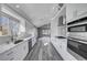 Bright kitchen with stainless steel appliances and marble countertops at 5236 Woodlawn Ln, Las Vegas, NV 89130