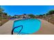 Community pool with lounge chairs and spa at 5236 Woodlawn Ln, Las Vegas, NV 89130