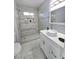 Modern bathroom with white vanity and tile shower at 5260 San Anselmo St, Las Vegas, NV 89120