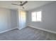 Well-lit bedroom with carpet and ceiling fan at 5260 San Anselmo St, Las Vegas, NV 89120