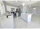 Modern kitchen with white cabinets and stainless steel appliances at 5260 San Anselmo St, Las Vegas, NV 89120