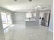 Open concept living area with marble floors and kitchen island at 5260 San Anselmo St, Las Vegas, NV 89120