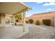 The backyard features desert landscaping, solar panels, and a covered patio area at 5804 Sassa St, Las Vegas, NV 89130