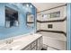 Bathroom featuring double sinks, shower and tub combination, and decorative tile at 5804 Sassa St, Las Vegas, NV 89130