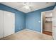 A carpeted bedroom with a ceiling fan and a closet at 5804 Sassa St, Las Vegas, NV 89130