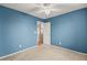 A carpeted bedroom with a ceiling fan at 5804 Sassa St, Las Vegas, NV 89130