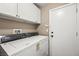 Modern laundry room equipped with washer and dryer machines at 5804 Sassa St, Las Vegas, NV 89130