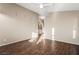 Bright living room featuring wood-look flooring, a ceiling fan, and neutral paint at 5804 Sassa St, Las Vegas, NV 89130