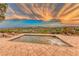 Enjoy stunning sunset views from this luxurious poolside patio at 59 Portezza Dr, Henderson, NV 89011