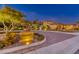 Night view of upscale community with Mediterranean style homes at 59 Portezza Dr, Henderson, NV 89011