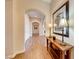 Bright hallway with hardwood floors and arched doorways at 59 Portezza Dr, Henderson, NV 89011