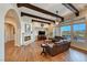 Large living room with hardwood floors, exposed beams, and a view at 59 Portezza Dr, Henderson, NV 89011