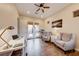 Home office with wood floors, two armchairs and French doors leading to patio at 59 Portezza Dr, Henderson, NV 89011