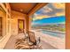 Covered patio overlooking a pool and scenic mountain view at 59 Portezza Dr, Henderson, NV 89011