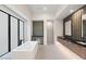 Bright bathroom featuring a soaking tub and a stylish vanity at 591 Overlook Rim Dr, Henderson, NV 89012