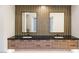 Modern bathroom featuring double sinks, sleek vanities, and stylish mirrors at 591 Overlook Rim Dr, Henderson, NV 89012