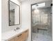 Sleek bathroom featuring a glass-enclosed shower with decorative tile and contemporary fixtures at 591 Overlook Rim Dr, Henderson, NV 89012