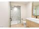 Contemporary bathroom showcasing a sleek vanity, glass-enclosed shower with designer tile, and modern finishes at 591 Overlook Rim Dr, Henderson, NV 89012