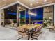 Elegant dining room with modern light fixture and sliding glass doors to the outdoor space at 591 Overlook Rim Dr, Henderson, NV 89012