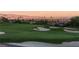 Beautiful green golf course with sand traps and the Las Vegas skyline as a scenic backdrop at 591 Overlook Rim Dr, Henderson, NV 89012