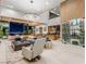 Bright living area with an open floor plan and elegant furnishings, showcasing seamless indoor-outdoor flow at 591 Overlook Rim Dr, Henderson, NV 89012