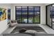 Modern main bedroom with large windows framing a panoramic view of the Las Vegas skyline at 591 Overlook Rim Dr, Henderson, NV 89012