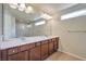 Double vanity bathroom with marble countertop and large mirror at 5993 Lambert Bridge Ave, Las Vegas, NV 89139