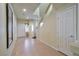 Tiled entryway with a full-length mirror and a white door at 5993 Lambert Bridge Ave, Las Vegas, NV 89139