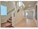 Bright entryway with tiled floors, stairs, and a view of the living room at 5993 Lambert Bridge Ave, Las Vegas, NV 89139