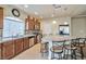 Kitchen with an island, stainless steel appliances, and wood cabinets at 5993 Lambert Bridge Ave, Las Vegas, NV 89139