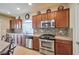 Modern kitchen with stainless steel appliances and mosaic backsplash at 5993 Lambert Bridge Ave, Las Vegas, NV 89139