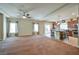 Spacious living room with carpet flooring and open kitchen access at 5993 Lambert Bridge Ave, Las Vegas, NV 89139