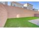 Artificial turf backyard with block wall and patio at 7075 Jasper Hill Way, Las Vegas, NV 89118