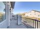 Private balcony overlooks community. Features a metal railing and stone pillars at 7075 Jasper Hill Way, Las Vegas, NV 89118