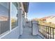 Private balcony with view of neighboring homes and landscaping at 7075 Jasper Hill Way, Las Vegas, NV 89118