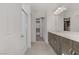 Modern bathroom with double vanity, shower, and walk-in closet at 7075 Jasper Hill Way, Las Vegas, NV 89118