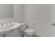 Clean and simple bathroom with a pedestal sink and toilet at 7075 Jasper Hill Way, Las Vegas, NV 89118