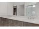 Bathroom showcasing double sinks, sleek countertops, and modern fixtures at 7075 Jasper Hill Way, Las Vegas, NV 89118
