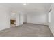 Bedroom view with carpet, bright walls, and access to an en-suite bathroom at 7075 Jasper Hill Way, Las Vegas, NV 89118
