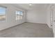 Spacious, light-filled bedroom with plush carpet and plenty of natural light at 7075 Jasper Hill Way, Las Vegas, NV 89118