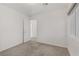 The carpeted bedroom offers a calming space with easy access to the en suite bathroom at 7075 Jasper Hill Way, Las Vegas, NV 89118