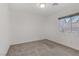 Bright bedroom with neutral walls and carpet at 7075 Jasper Hill Way, Las Vegas, NV 89118