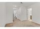 Bright bedroom features neutral carpet, white walls, and ensuite bathroom for comfortable living at 7075 Jasper Hill Way, Las Vegas, NV 89118