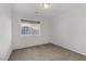 Bright bedroom with a large window that fills the space with natural light and neutral carpet at 7075 Jasper Hill Way, Las Vegas, NV 89118