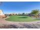 Community park with an expansive artificial turf area and walking path provides a great space to relax at 7075 Jasper Hill Way, Las Vegas, NV 89118